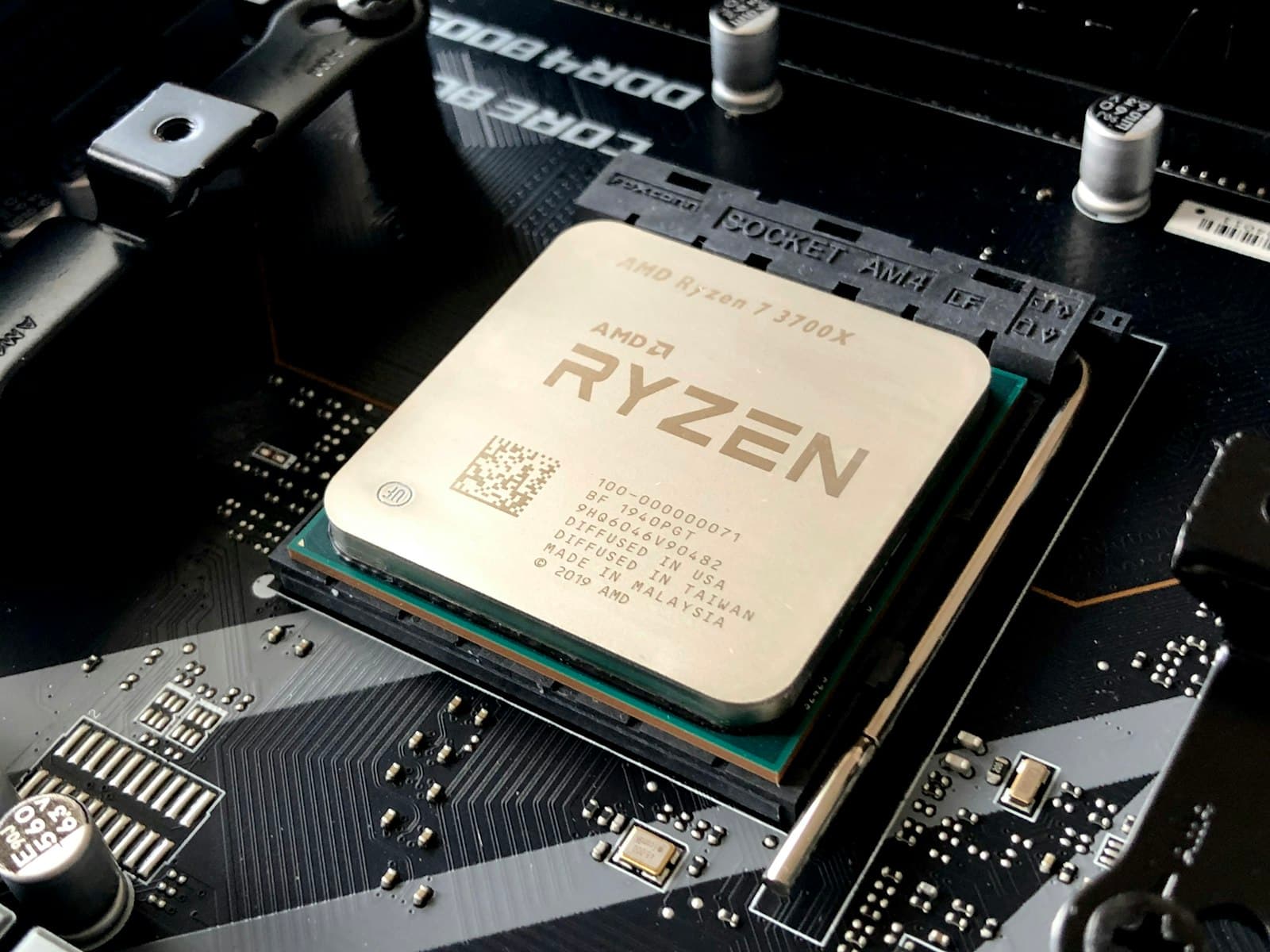 A processor seated in its socket, part number and QR code printed across the heat spreader